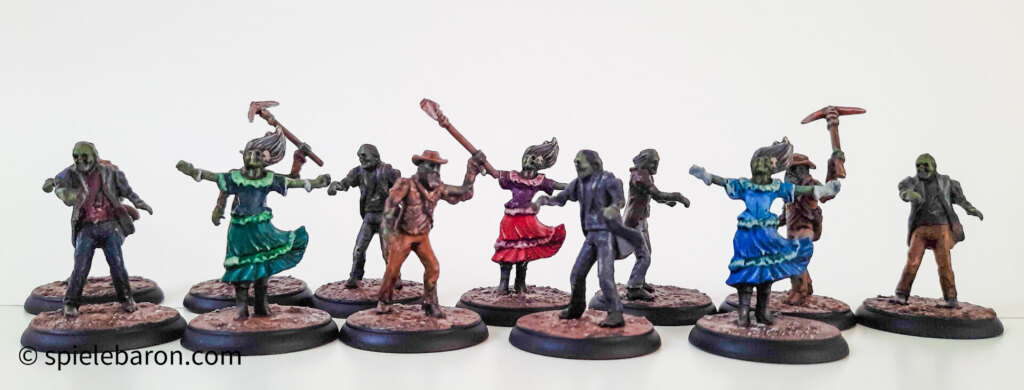 Showcase Foto zu Shadows of Brimstone, bemalte Figuren, Zombies auf Mine Bases vor weißem Hintergrund